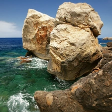 Sky, boulders, sea