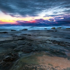 Stones, rays, sun, sea, east