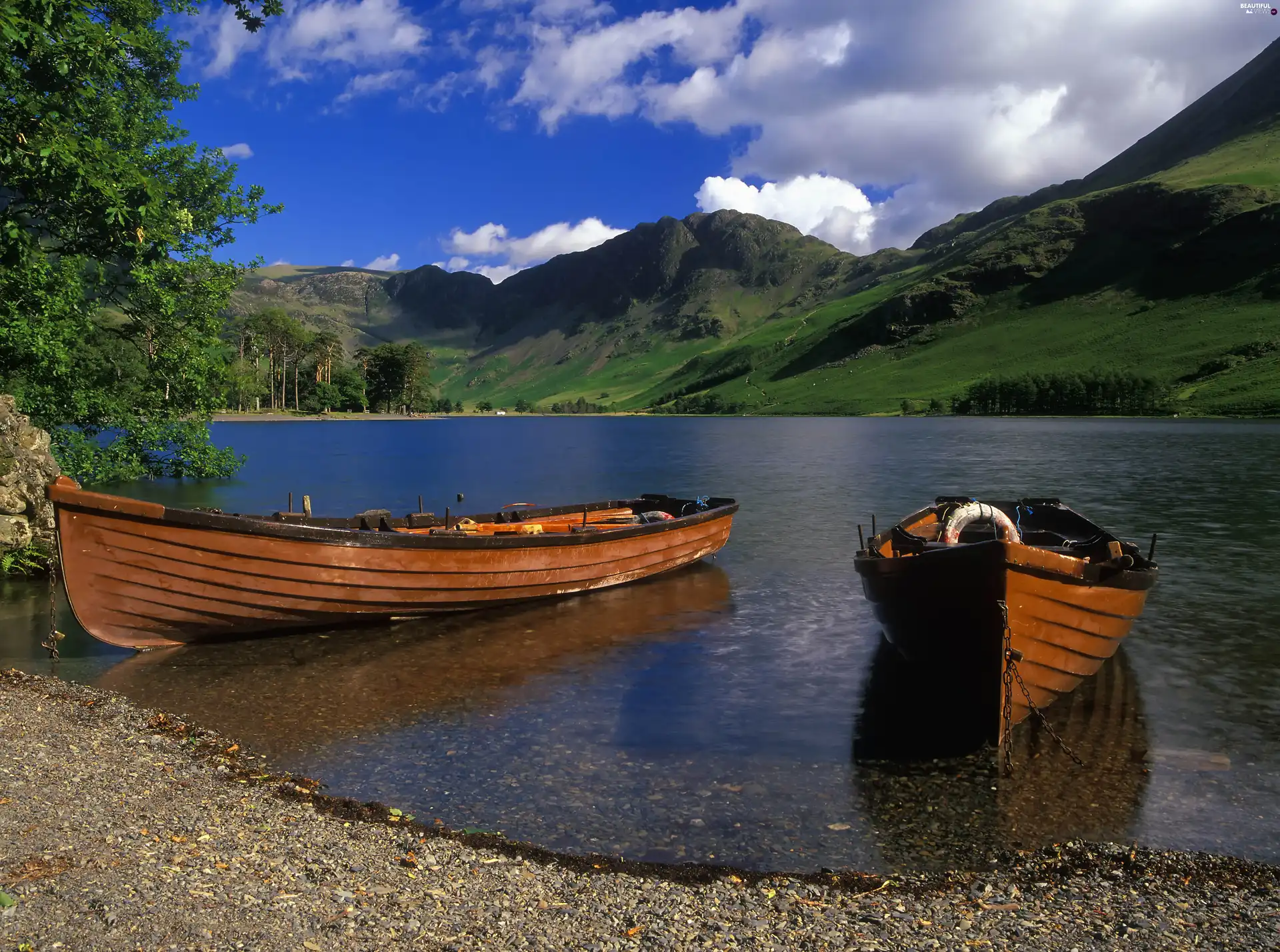 Mountains, lake, boats, clouds