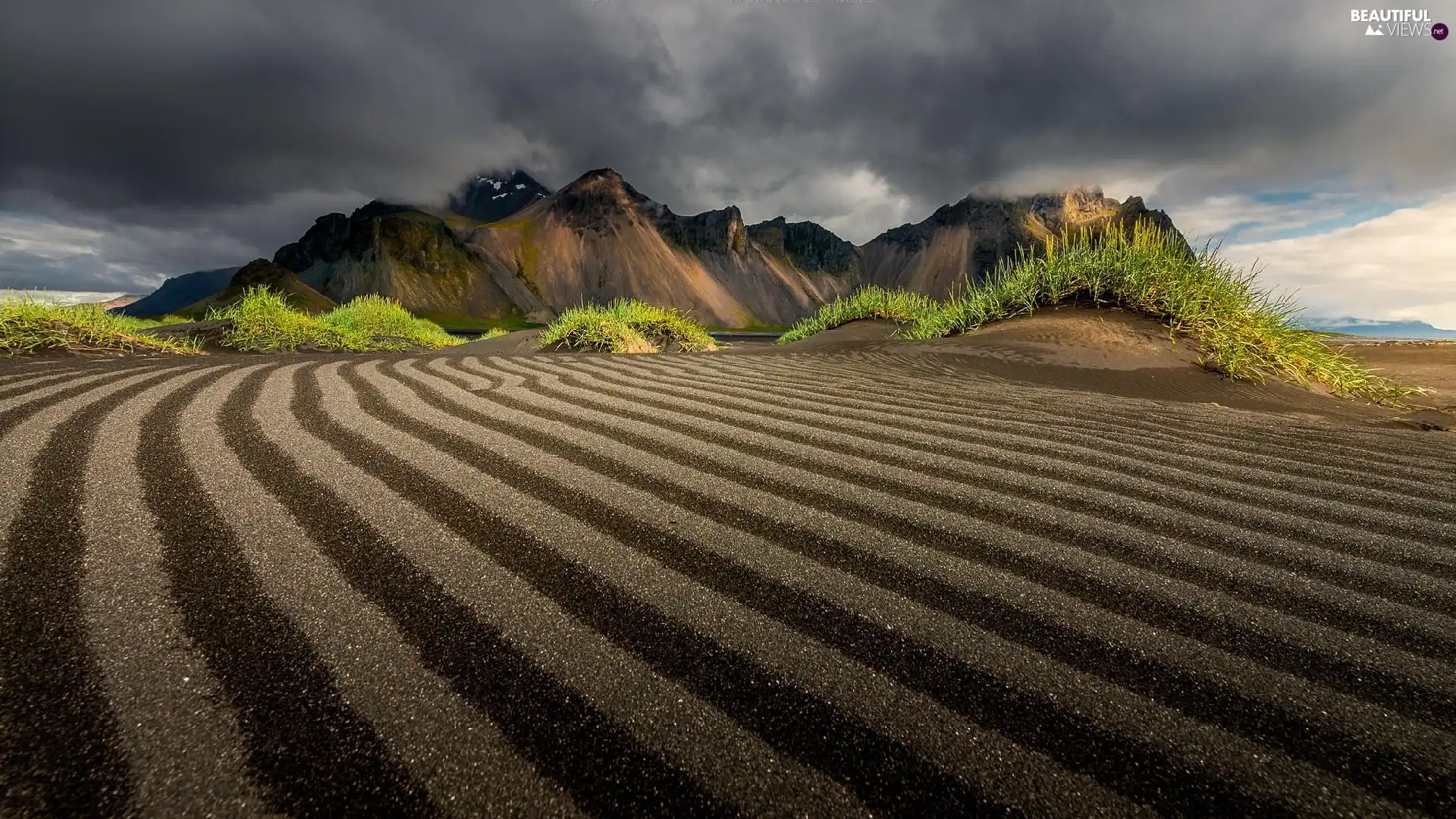 Mountains, Plowed Field, Clouds darkened the Skies