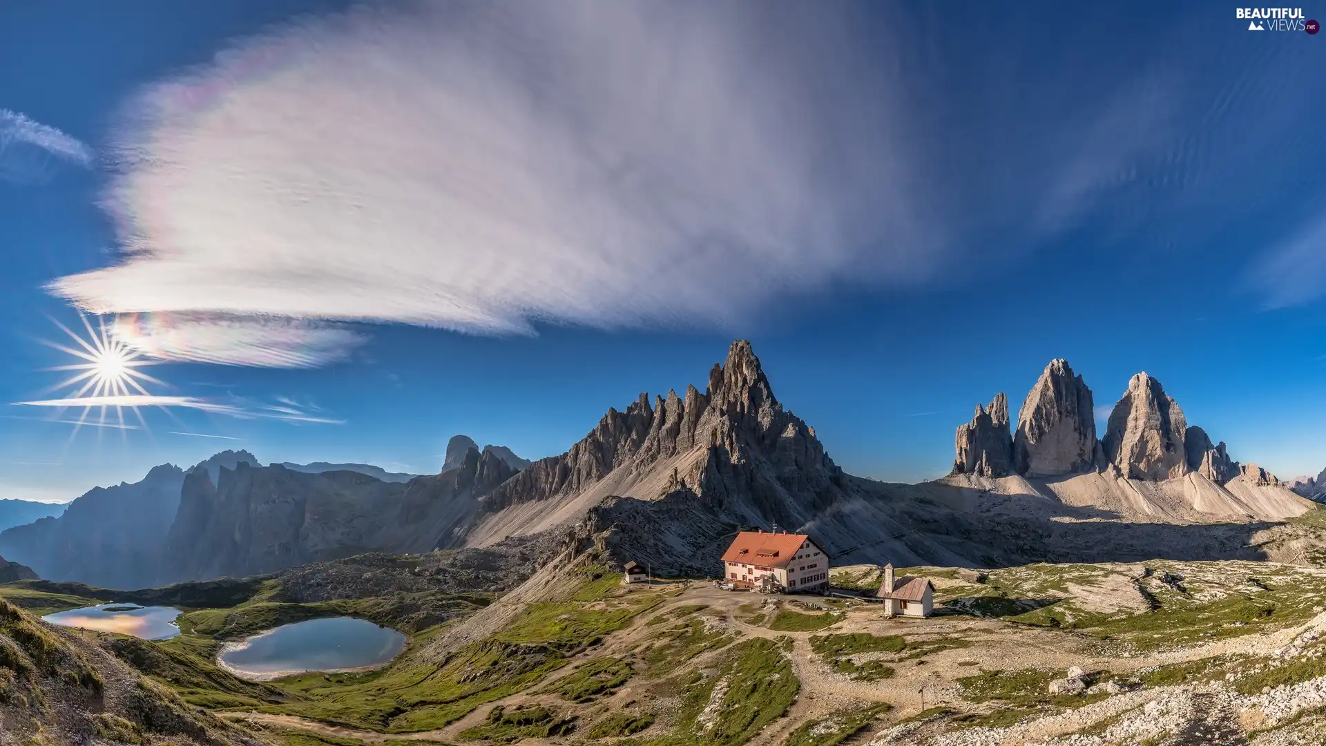 Paternkofel Mountain, Mountains Tre Cime di Lavaredo, lakes, Hostel Dreizinnen Hut, clouds, Dolomites, Italy, rays of the Sun