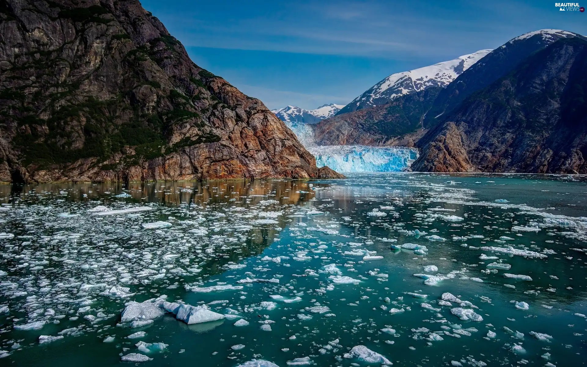 Mountains, cuts, ice, lake