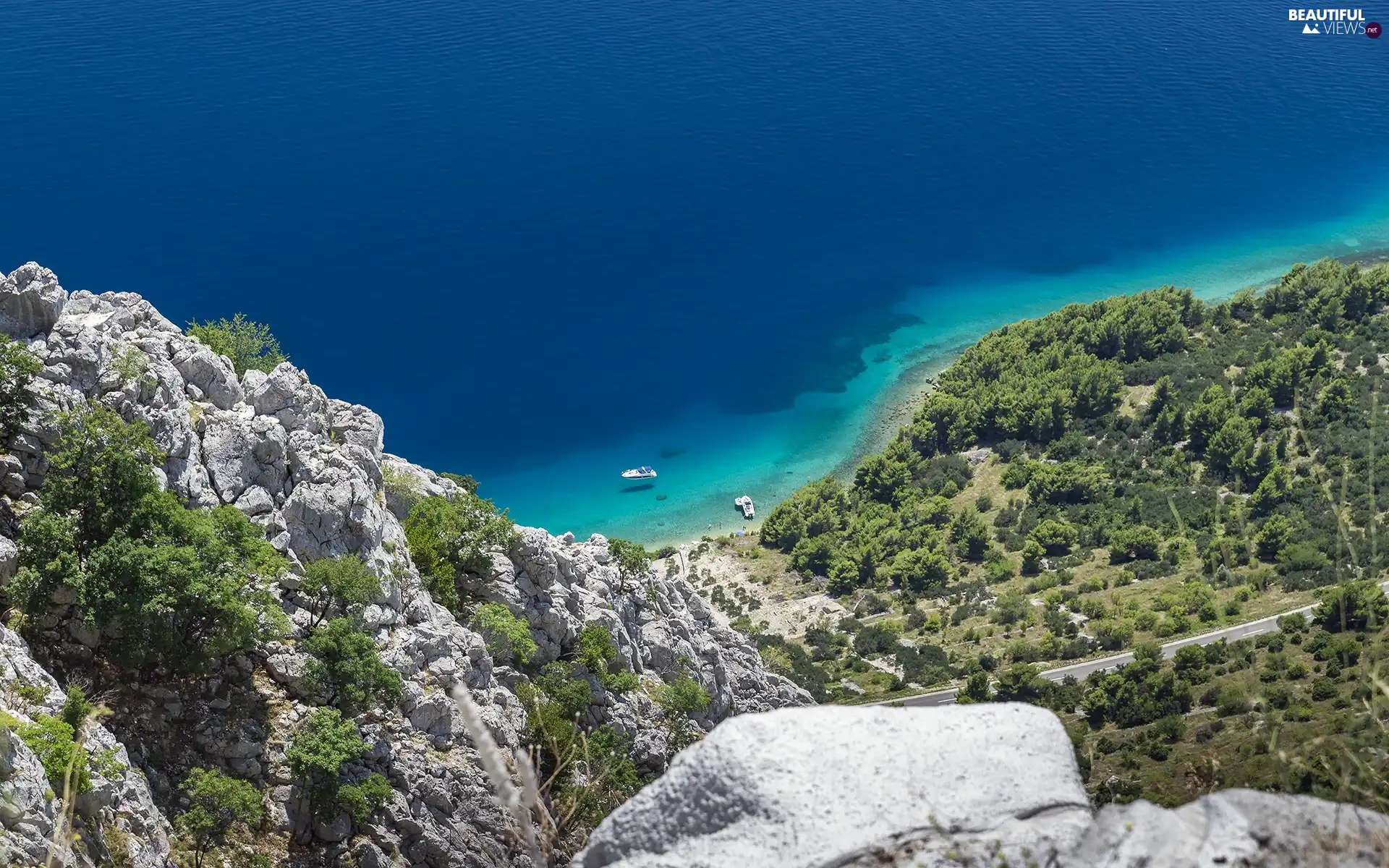 Mountains, rocks, motorboat, sea