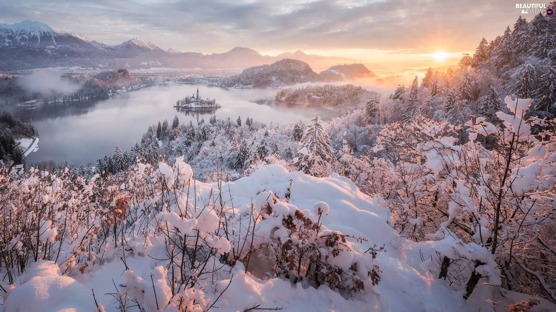 Slovenia, winter, Islet, Lake Bled, trees, rays of the Sun, Bush, Mountains, snow, viewes, Snowy