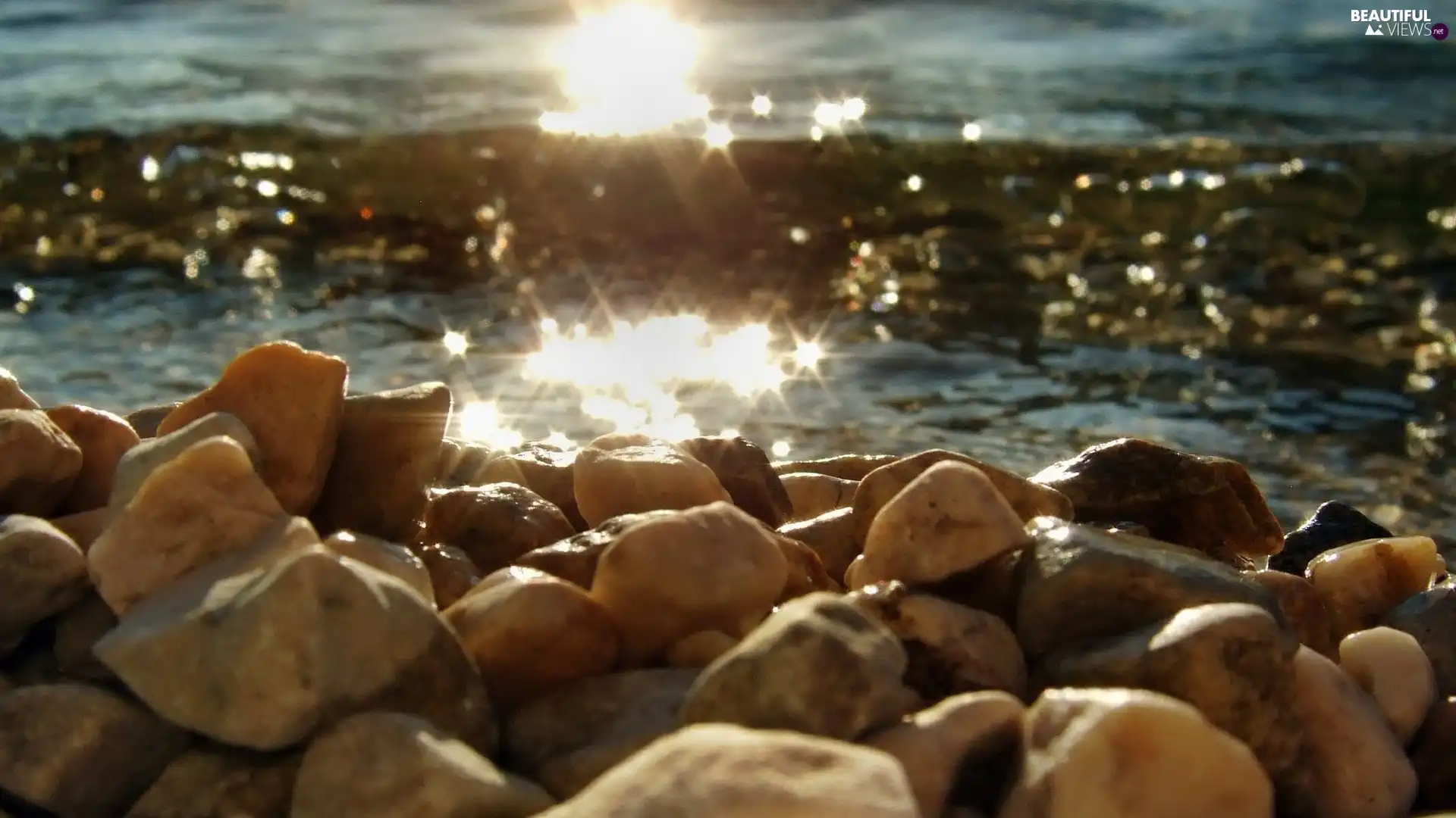 Stones, River, rays of the Sun