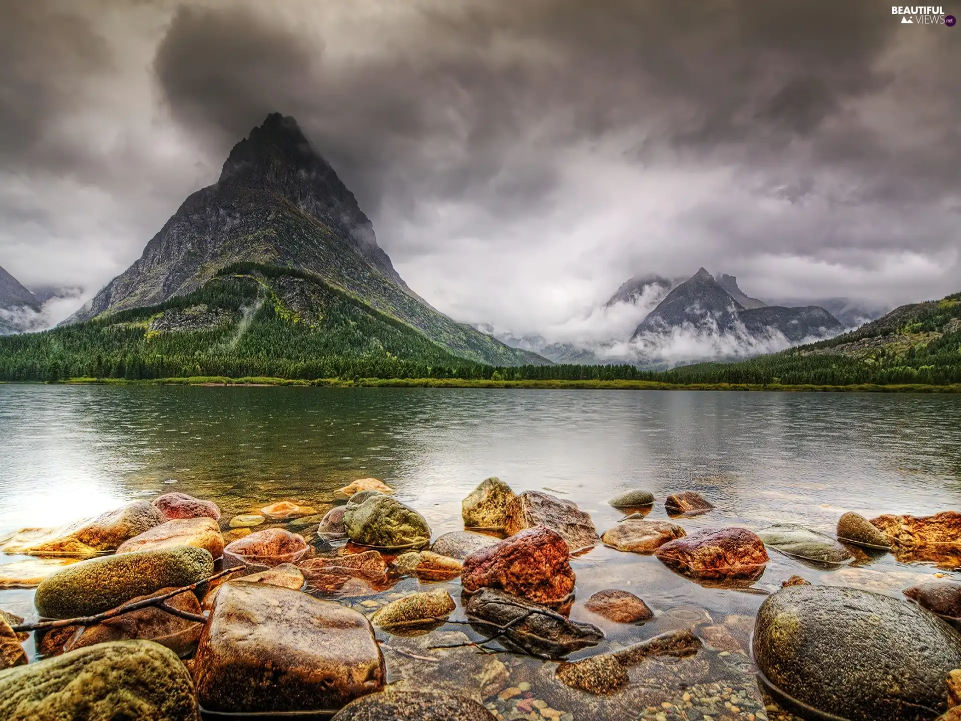 Stones, mountains, lake