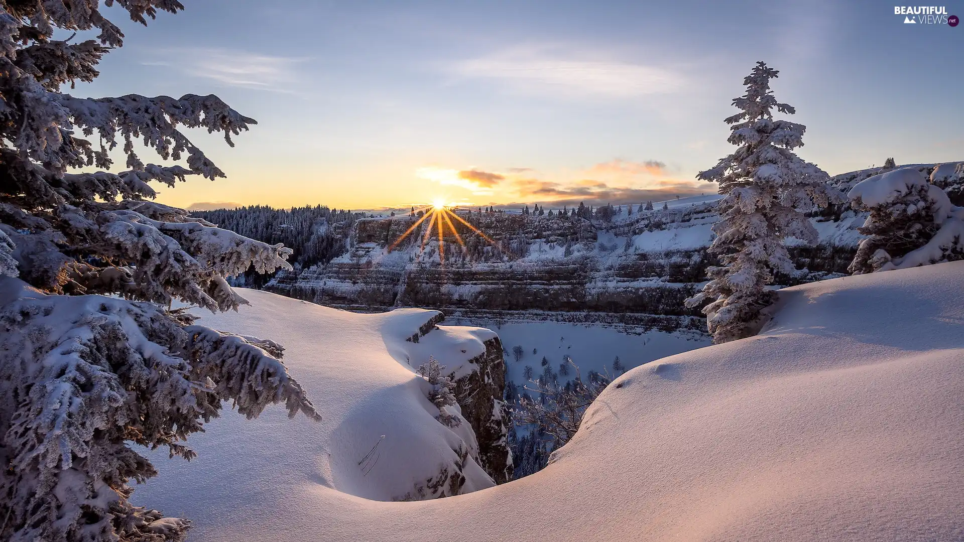 snow, Neuchatel Canton, rays of the Sun, winter, Switzerland, rocks, Spruces