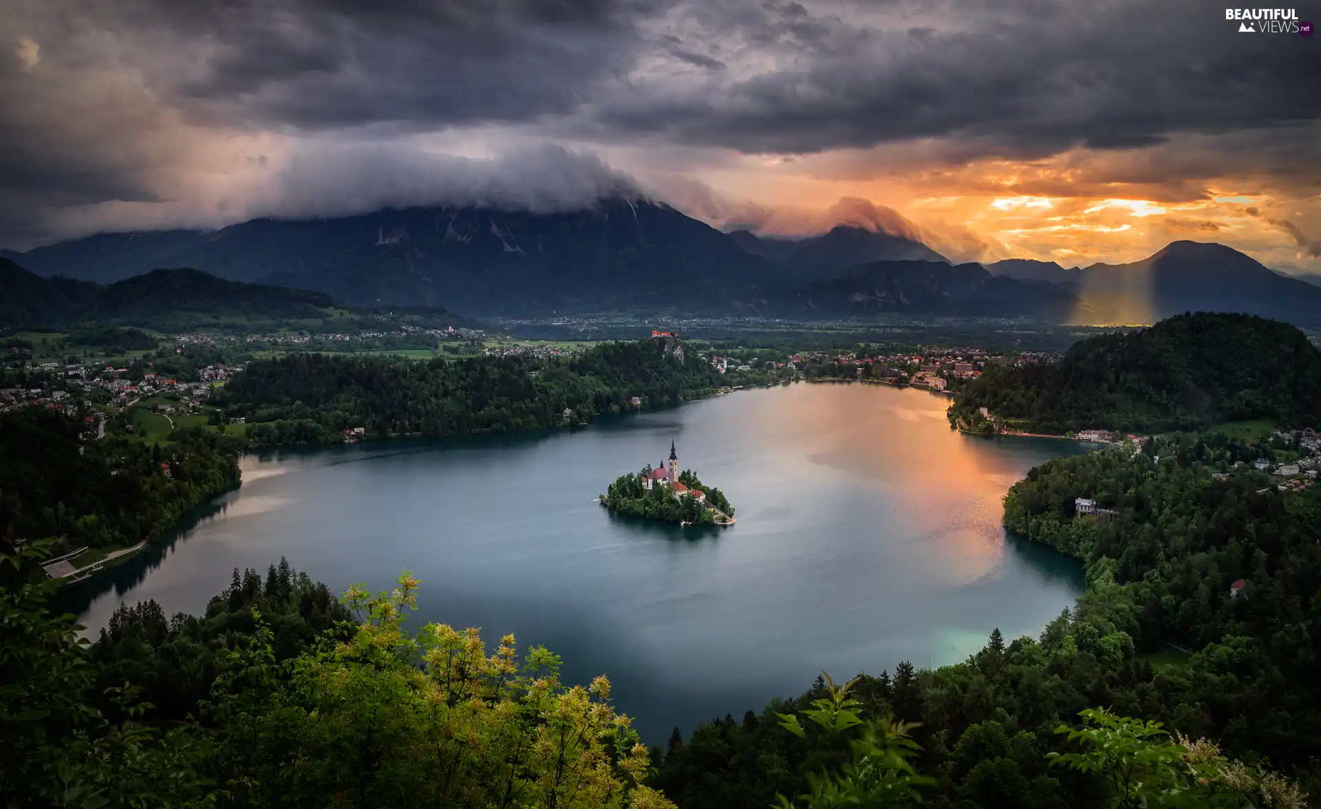 Lake Bled, Blejski Otok Island, light breaking through sky, Julian Alps Mountains, Slovenia, morning, clouds
